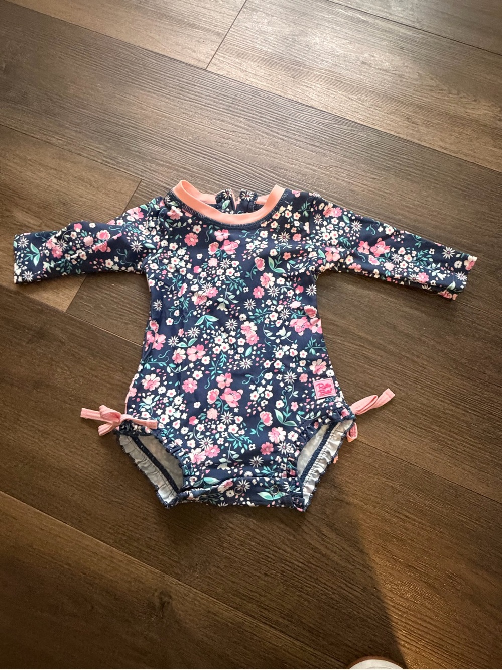 Ruffle Butts Navy Floral Long-Sleeve One-Piece Swimsuit with Pink Trim
